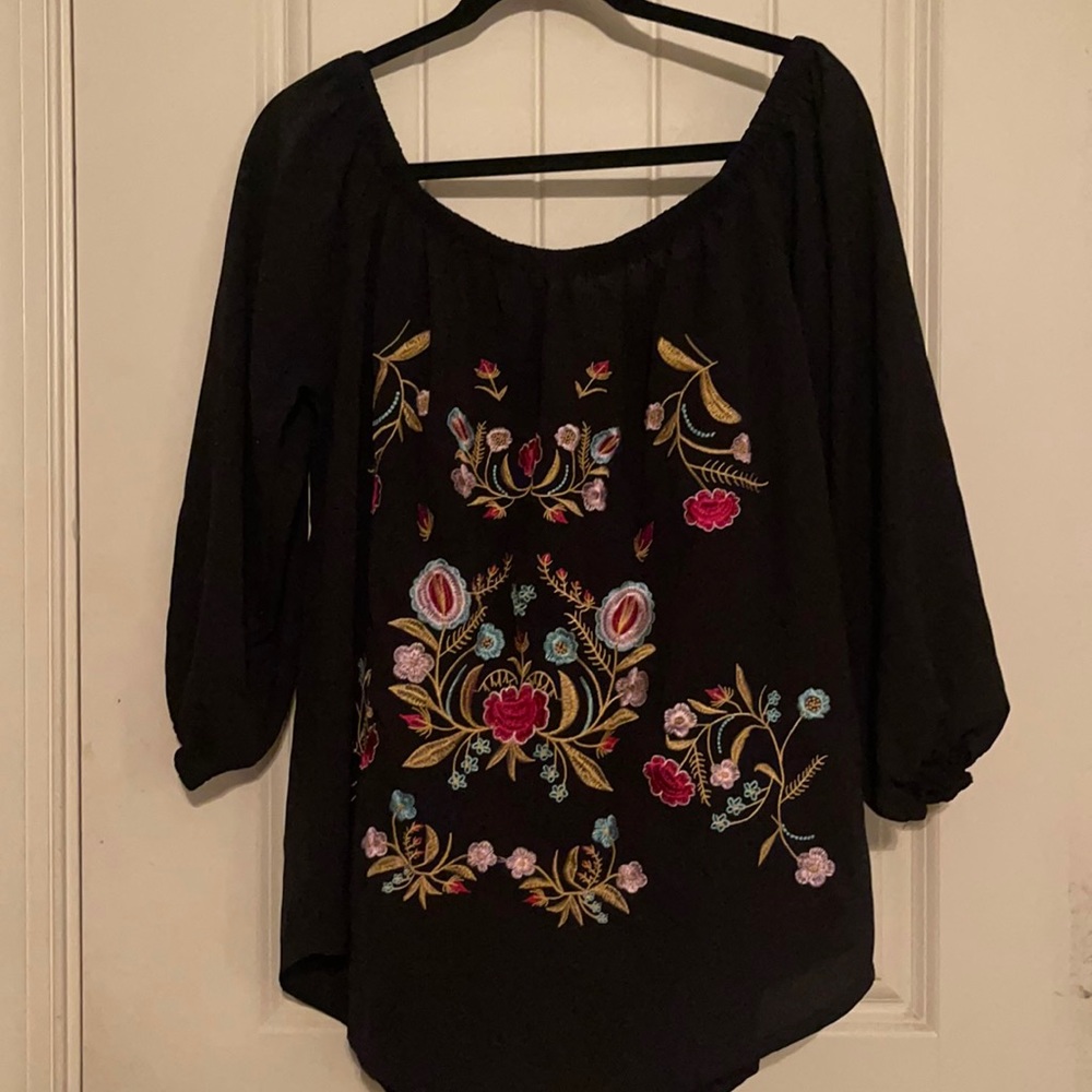 Black top. Floral design on front. Can be worn off the shoulder. Size XXL